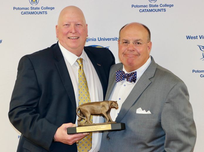 WVU Potomac State College Alumnus Conrad Carney II (left), Class of 1983, was recently inducted into the PSC Athletic Hall of Fame for his abilities on and off the field.  Introducing Carney was long-time friend and teammate John Matlak.