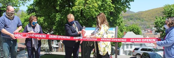 WVU Potomac State College President Jennifer Orlikoff and Mineral County Tourism Executive Director Ashley Centofonti cut the ribbon to commemorate the new Civil War Trail sign beside the Mary F. Shipper Library on the College campus. 