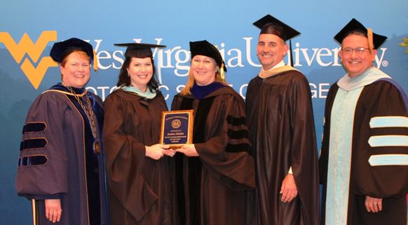 Education Professor Andrea Schafer, second from left, was named WVU Potomac State College’s 2019 Outstanding Professor of the Year. Making the presentation was (from left): Campus President Jennifer Orlikoff; Sheryl Chisholm, Faculty Assembly Chair and Bi