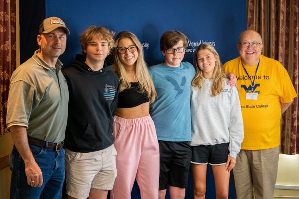 The Grinnan quadruplets embarked on their academic journeys as freshmen this fall at WVU Potomac State College, in Keyser, W.Va. Pictured during Move-In Day from left are: Parent Mike Grinnan, Michael, Allie, Chris, Maria, and Interim Campus President Chr