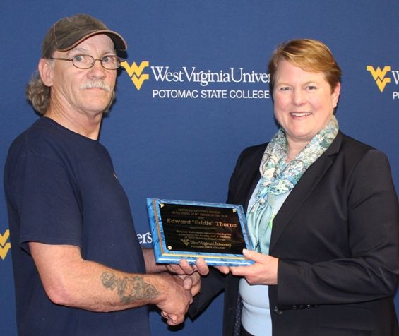 Eddie Thorne, a maintenance worker in Housing and Resident Life, was recently named the 2019 Outstanding Classified Staff Person of the Year at WVU Potomac State College. Making the presentation was Campus President Jennifer Orlikoff, PhD.