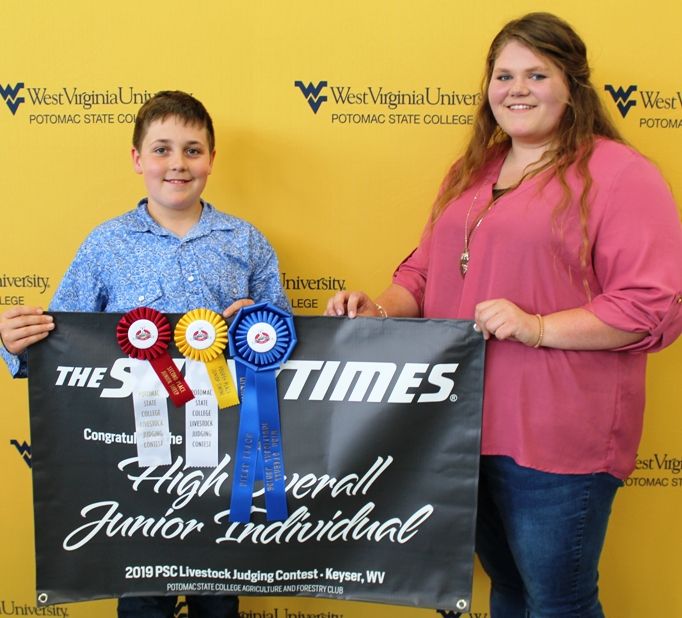 Trey Myers, a member of the Bedford County, Pa. 4-H, was named High Overall Junior Individual. His coaches are Scott and Leslie Myers. Presenting the award was WVU Potomac State College Student Maggie Waugh, a sophomore Agriculture and Environmental Educa