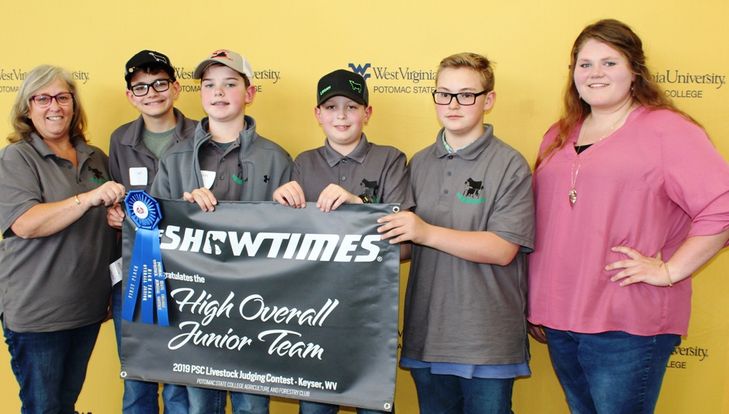 Claiming the High Overall Junior Team award was Monongalia County 4-H Junior Team No. 1. Pictured from left are: Coach Deb Dean, Jones Tanton, Chris Blosser, Logan Slider, and Caden Lipscomp. Presenting the awards was WVU Potomac State College Student Mag