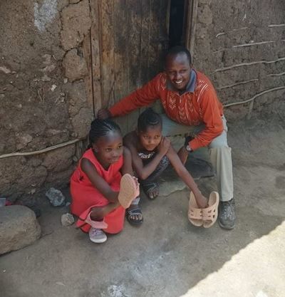 Sammy, a nurse from Nairobi, delivers shoes to those in need.  