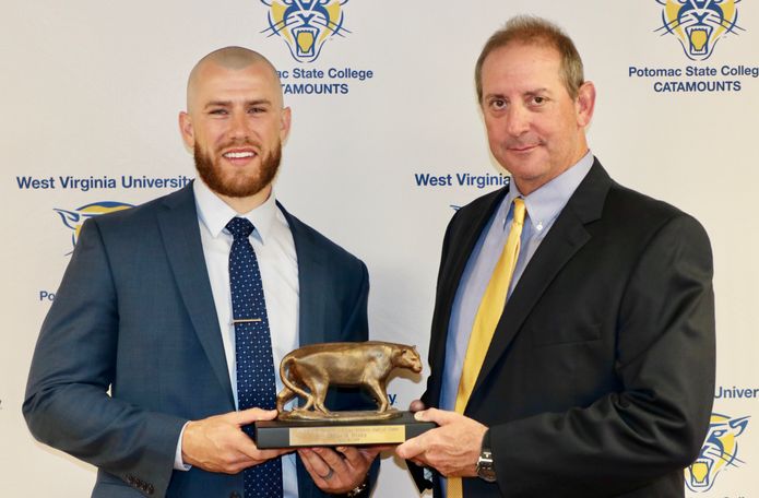 WVU Potomac State College Alumnus Jacke Healey (left) Class of 2008, was recently inducted into the PSC Athletic Hall of Fame for his acheivements on and off the field.  Presenting him with his award was PSC Head Baseball Coach Doug Little. 